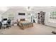 Spacious bedroom with a large window, desk, and bookcase at 130 Honey Ln, Fayetteville, GA 30214