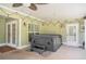 Relaxing covered patio with hot tub, ceiling fan, and string lights at 130 Honey Ln, Fayetteville, GA 30214