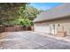 Long driveway leading to a 2-car garage with a fenced yard at 130 Honey Ln, Fayetteville, GA 30214