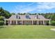 Charming one-story home with a large, inviting front porch and well-manicured lawn at 130 Honey Ln, Fayetteville, GA 30214