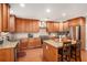 Spacious kitchen featuring granite countertops, wood cabinets, and a stainless steel refrigerator at 130 Honey Ln, Fayetteville, GA 30214