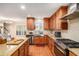 Bright kitchen with stainless appliances, wood cabinets, granite countertops and a window view at 130 Honey Ln, Fayetteville, GA 30214