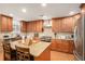 Kitchen showcasing wood cabinets, stainless steel appliances, and granite countertop island with seating at 130 Honey Ln, Fayetteville, GA 30214