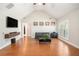 Bright living room with vaulted ceiling, hardwood floors, and ample natural light at 130 Honey Ln, Fayetteville, GA 30214