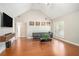 Bright living room with vaulted ceiling, hardwood floors, and ample natural light at 130 Honey Ln, Fayetteville, GA 30214