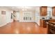 Spacious open area with hardwood floors adjacent to kitchen with plenty of room to relax at 130 Honey Ln, Fayetteville, GA 30214