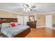 Large main bedroom offering wood floors, neutral walls, and ample closet space at 130 Honey Ln, Fayetteville, GA 30214