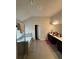 Well-lit bathroom featuring tile flooring, a soaking tub, and double vanity sinks at 419 Woodmill Way, Atlanta, GA 30331