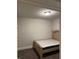 Basic bedroom featuring neutral walls, carpet flooring, and a simple bed frame with mattress at 419 Woodmill Way, Atlanta, GA 30331
