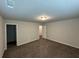 Bedroom features neutral walls, gray carpeting, closet, and doorway at 419 Woodmill Way, Atlanta, GA 30331