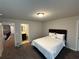 Bedroom features neutral wall colors and ensuite bathroom access at 419 Woodmill Way, Atlanta, GA 30331