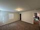 Bedroom featuring neutral walls, gray carpeting and a single large window at 419 Woodmill Way, Atlanta, GA 30331