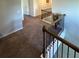 Hallway features neutral walls, gray carpet, and dark metal railing at 419 Woodmill Way, Atlanta, GA 30331