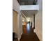 Inviting hallway with hardwood floors leads to open-concept living spaces, enhanced by elegant moldings at 419 Woodmill Way, Atlanta, GA 30331