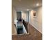 Hallway view of landing area with black metal railing and artwork on the wall at 419 Woodmill Way, Atlanta, GA 30331