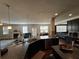 Open concept kitchen with granite countertops, dark cabinetry, stainless steel dishwasher, and pendant lighting at 419 Woodmill Way, Atlanta, GA 30331