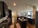 Spacious kitchen with dark wood cabinetry, granite countertops, and open view to the living spaces at 419 Woodmill Way, Atlanta, GA 30331