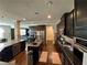 Modern kitchen with dark cabinets, stainless steel appliances, and an open view to other rooms at 419 Woodmill Way, Atlanta, GA 30331