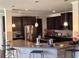 Modern kitchen featuring dark cabinetry, stainless steel appliances, and a granite-topped island with seating at 419 Woodmill Way, Atlanta, GA 30331