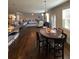 Inviting living area featuring hardwood floors, a dining table, and a glimpse of a cozy living space at 419 Woodmill Way, Atlanta, GA 30331