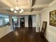 Open floor plan of dining room and kitchen featuring hardwood floors at 419 Woodmill Way, Atlanta, GA 30331