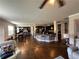 Expansive open floor plan showcasing the kitchen, dining area, and living room with hardwood floors at 419 Woodmill Way, Atlanta, GA 30331