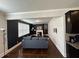 Cozy living room with dark accent wall, fireplace, and large window providing natural light at 419 Woodmill Way, Atlanta, GA 30331