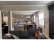 Open layout showcasing kitchen, living, and dining areas with hardwood floors and neutral tones at 419 Woodmill Way, Atlanta, GA 30331