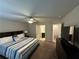 Comfortable bedroom featuring an ensuite bathroom and dark wood furniture at 419 Woodmill Way, Atlanta, GA 30331
