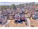 An aerial shot of a beautiful home with a well-kept lawn, surrounded by lush greenery and other houses at 4213 Bretdale Nw Run, Kennesaw, GA 30152