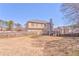 Large backyard with a wooden fence and deck, providing a private outdoor space for recreation and relaxation at 4213 Bretdale Nw Run, Kennesaw, GA 30152