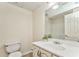 Clean bathroom featuring a vanity, toilet, shower and mirrored wall at 4213 Bretdale Nw Run, Kennesaw, GA 30152