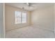 Bedroom featuring neutral walls, carpet, ceiling fan, and a window with blinds at 4213 Bretdale Nw Run, Kennesaw, GA 30152