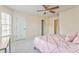 Bright bedroom with neutral walls, carpet and ceiling fan, plus closet door at 4213 Bretdale Nw Run, Kennesaw, GA 30152