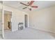Bedroom featuring neutral walls, carpet, ceiling fan, and a connecting door to the hallway at 4213 Bretdale Nw Run, Kennesaw, GA 30152