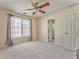 Bedroom with a ceiling fan, a window with sheer curtains, and an ensuite bathroom at 4213 Bretdale Nw Run, Kennesaw, GA 30152