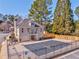 Aerial view of community pool with surrounding fence, clubhouse, and manicured landscaping at 4213 Bretdale Nw Run, Kennesaw, GA 30152