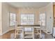 Cozy dining area with large windows, built-in table, and hardwood floors at 4213 Bretdale Nw Run, Kennesaw, GA 30152