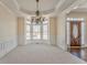 Elegant dining room with decorative chandelier, wainscoting and large bay windows at 4213 Bretdale Nw Run, Kennesaw, GA 30152