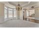 Elegant dining room with chandelier, large windows, and detailed trim at 4213 Bretdale Nw Run, Kennesaw, GA 30152