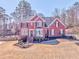 Charming two-story red brick home featuring a well-manicured lawn and inviting front entrance at 4213 Bretdale Nw Run, Kennesaw, GA 30152