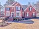 Classic red brick home features a well-manicured lawn and a welcoming front entrance at 4213 Bretdale Nw Run, Kennesaw, GA 30152