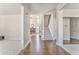Inviting foyer with hardwood floors, staircase, and a view into the living room at 4213 Bretdale Nw Run, Kennesaw, GA 30152