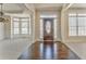 Elegant foyer showcasing hardwood floors, large windows, and an open floor plan at 4213 Bretdale Nw Run, Kennesaw, GA 30152