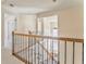 Hallway with carpeted stairs and natural wood handrail at 4213 Bretdale Nw Run, Kennesaw, GA 30152