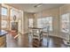 Open kitchen with a breakfast nook that is well-lit with natural light, hardwood floors and a fireplace at 4213 Bretdale Nw Run, Kennesaw, GA 30152