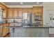 Well-equipped kitchen with stainless steel appliances, a granite island cooktop, and wooden cabinets at 4213 Bretdale Nw Run, Kennesaw, GA 30152
