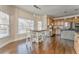 Open kitchen/dining area with wooden cabinets and stainless steel appliances at 4213 Bretdale Nw Run, Kennesaw, GA 30152