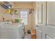 Functional laundry room equipped with a washer and dryer and storage shelves at 4213 Bretdale Nw Run, Kennesaw, GA 30152