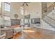 Large living room featuring fireplace, open staircase and lots of natural light at 4213 Bretdale Nw Run, Kennesaw, GA 30152